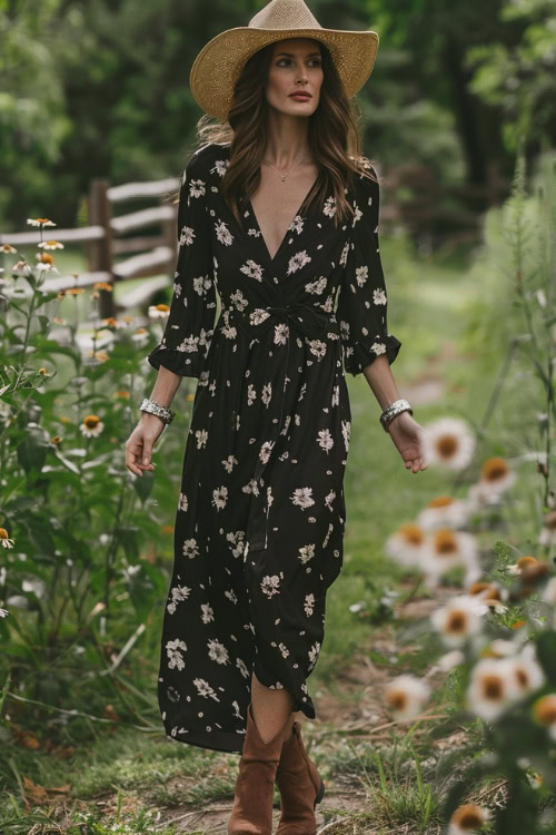 a woman wears black wrap floral dress and cowboy boots