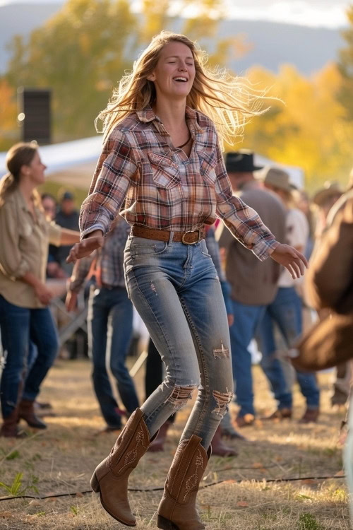 A woman wears a plaid shirt, ripped jeans, and brown cowboy boots