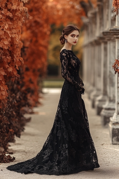 A woman wears a black lace long-sleeve wedding guest dress with a flowing skirt