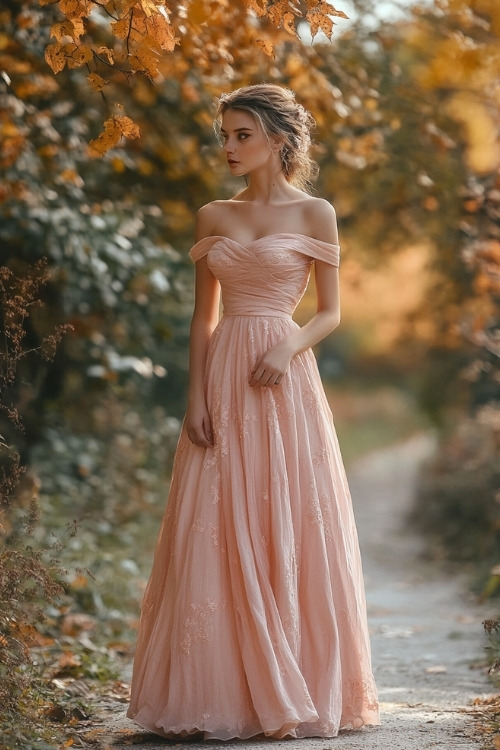 A woman wears a blush pink off-the-shoulder wedding guest dress