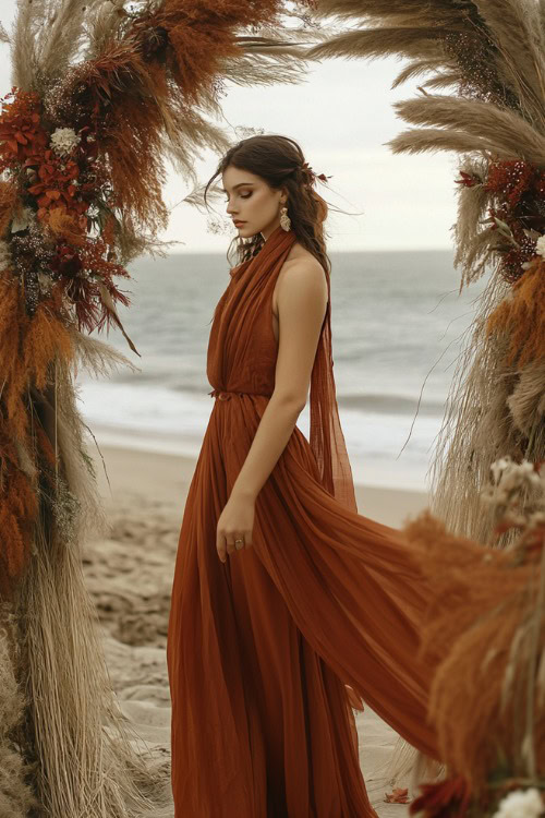 Layered look featuring a deep rust-colored maxi dress with a scarf and ankle-strap sandals