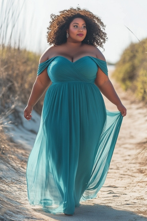 a plus size black woman wears a strapless blue off the shoulder wedding guest dress