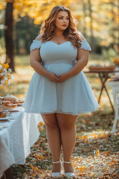 a plus size woman wears a light blue mini wedding guest dress with white heels