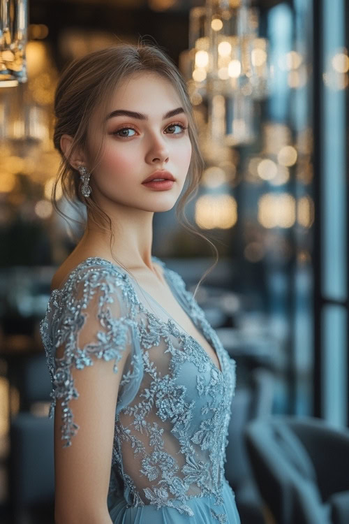 a woman wears a light blue lace wedding guest dress with a V neckline (3)