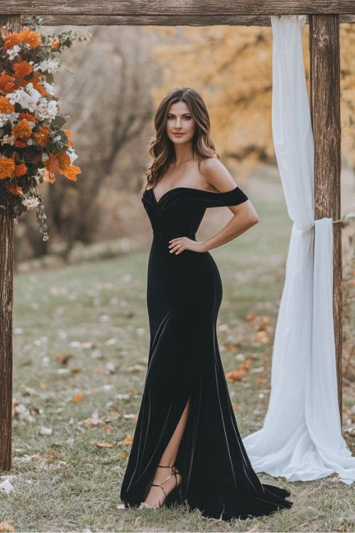 a woman wears an off shoulder black wedding guest dress