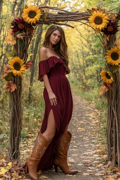 a woman wears an off shoulder burgundy wedding guest dress with brown cowboy boots