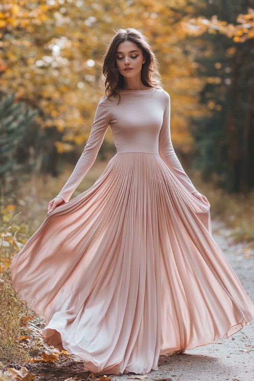 a woman wears a blush pink wedding guest dress with long sleeves