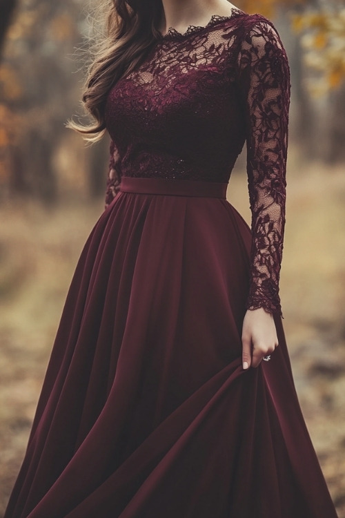 a woman wears a long burgundy wedding guest dress with lace sleeves