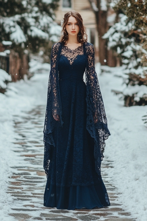 a woman wears a navy wedding guest dress and wide lace sleeves