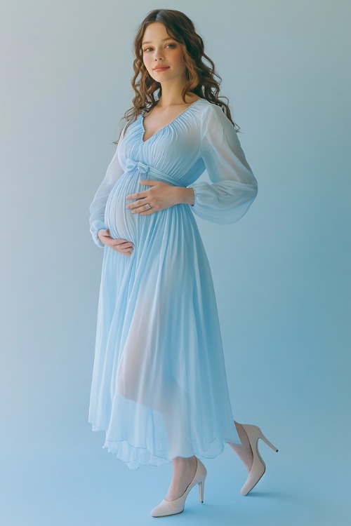 A charming maternity outfit showcasing a long-sleeve dress in powder blue chiffon, with a keyhole neckline, subtle ruching on the bodice