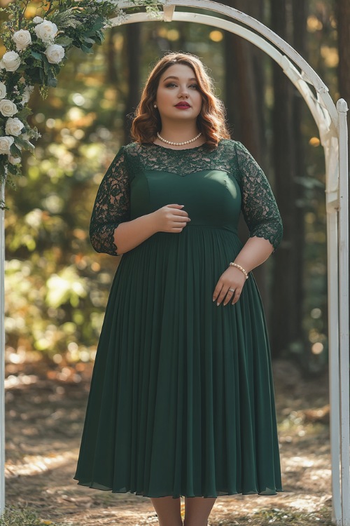 A plus-size woman wearing a forest green A-line midi dress with three-quarter lace sleeves and a pleated skirt, accessorized with heels and a small pearl necklace