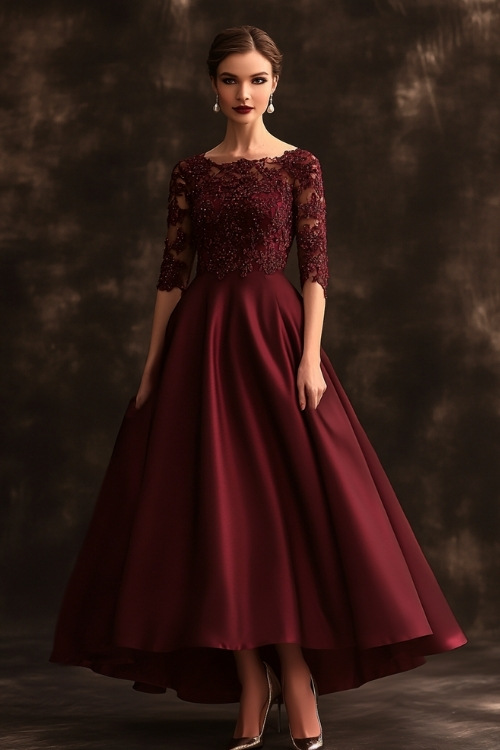 A tall woman wearing a wine-colored A-line gown with a boat neckline, three-quarter lace sleeves, and intricate embroidery at the bodice