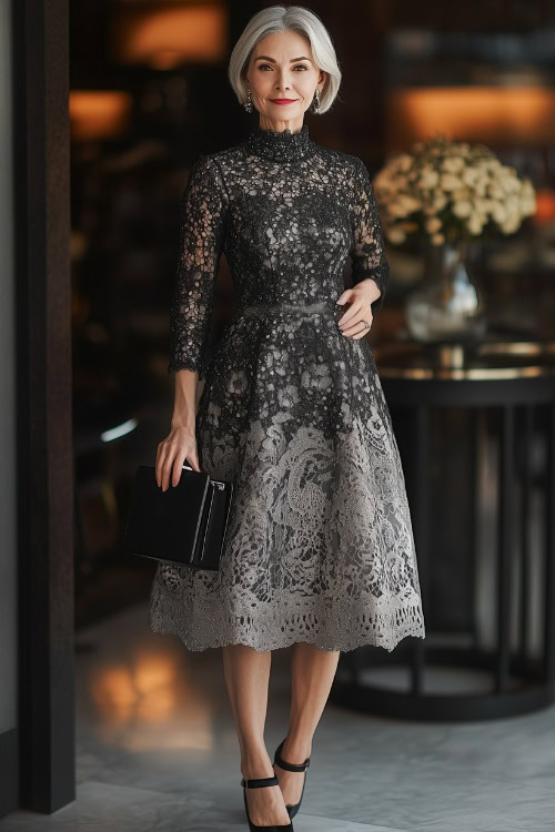 A petite woman over 50 in a black and silver knee-length dress with a high neckline and lace overlay