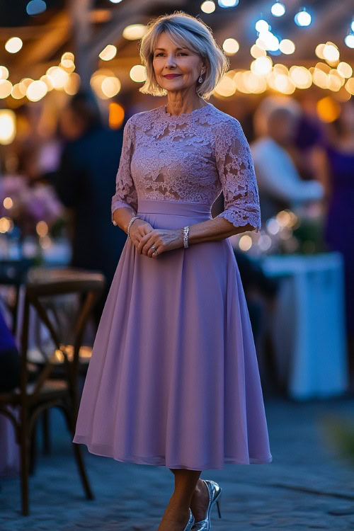 A petite woman over 50 in an elegant soft lilac A-line midi dress with lace detailing and a modest neckline