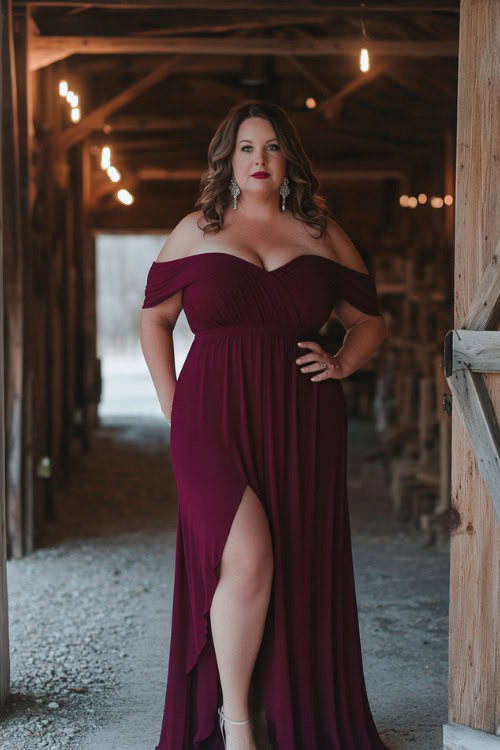 A plus-size woman over 50 in a chic off-the-shoulder burgundy maxi dress with an empire waist and a subtle slit